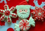 Iced Christmas biscuits shaped like Santa and snowflakes
