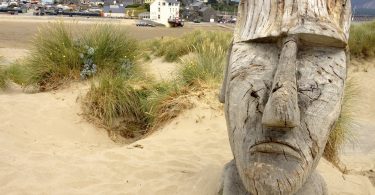 The Carved Head on Barmouth Beach